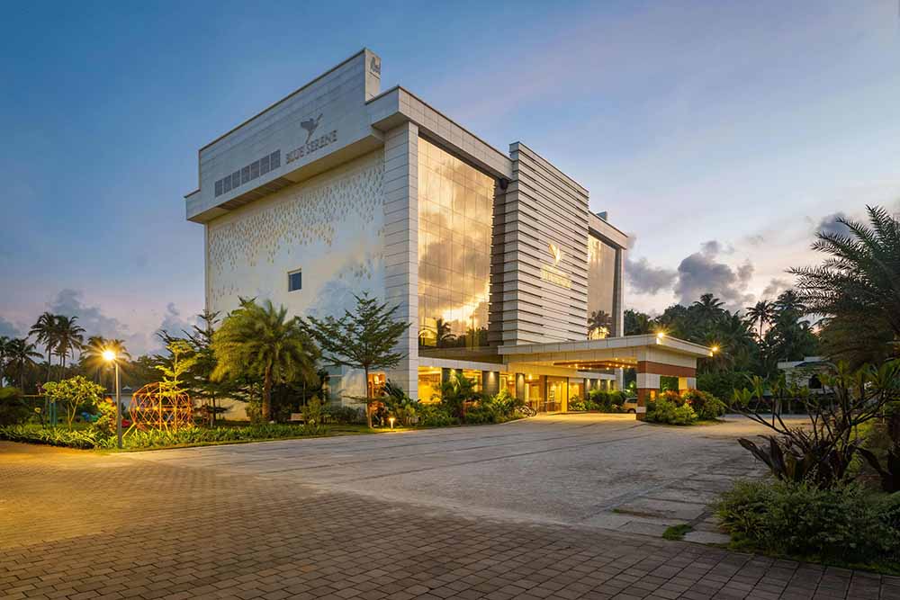 Welcoming entrance to Blue Serene resort with vibrant landscaping